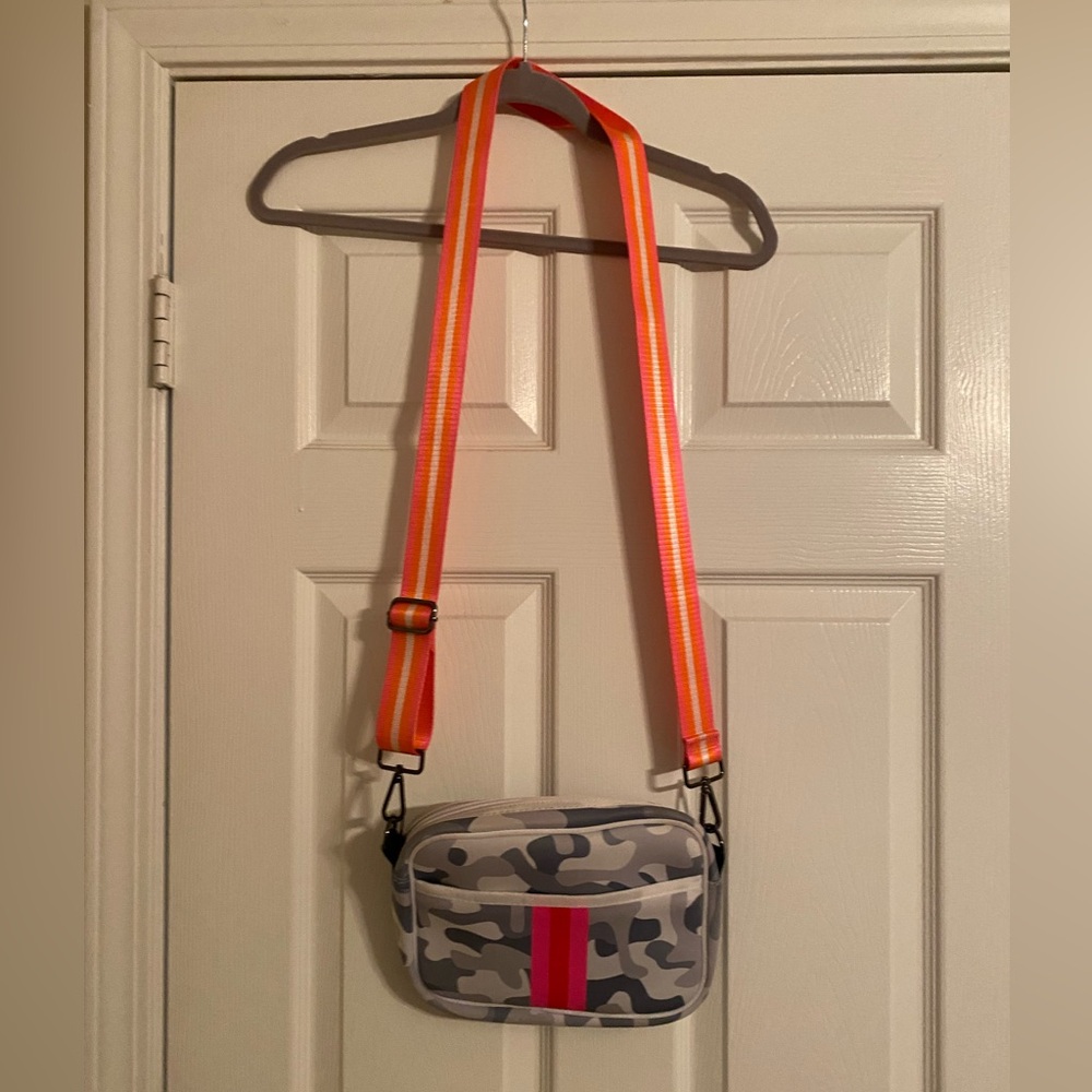 Haute Shore. Camouflage Crossbody Bag with Orange Strap. 9X7. NWOT. Front Pocket
